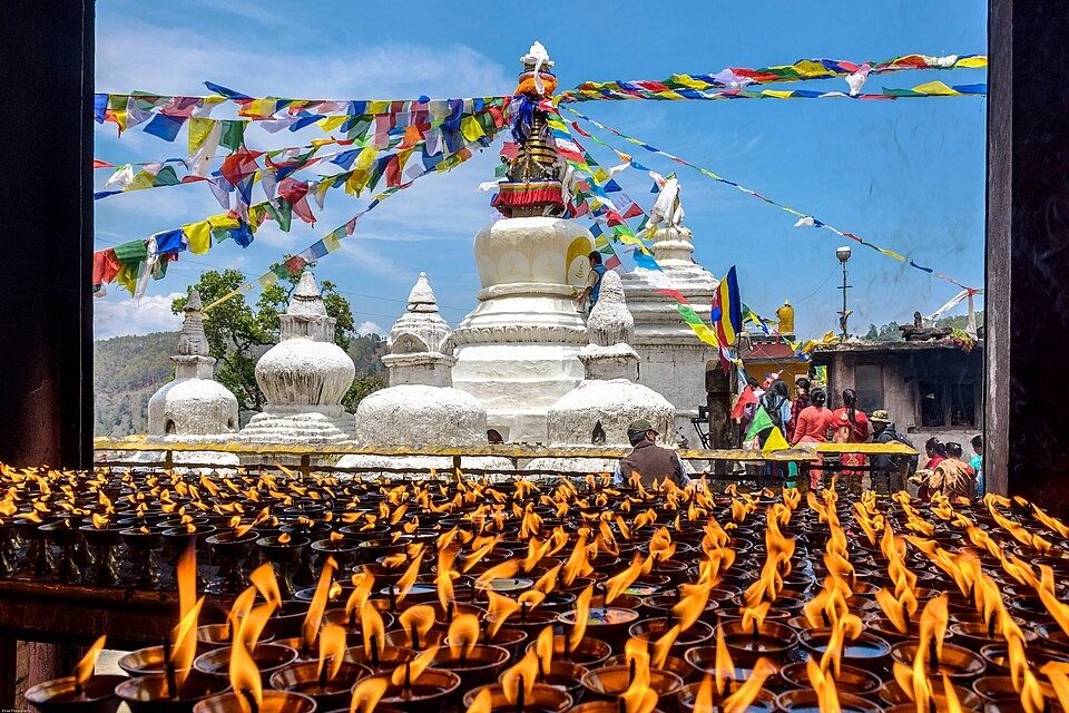 Butter lamps and prayer flags at the Namobuddha stupa