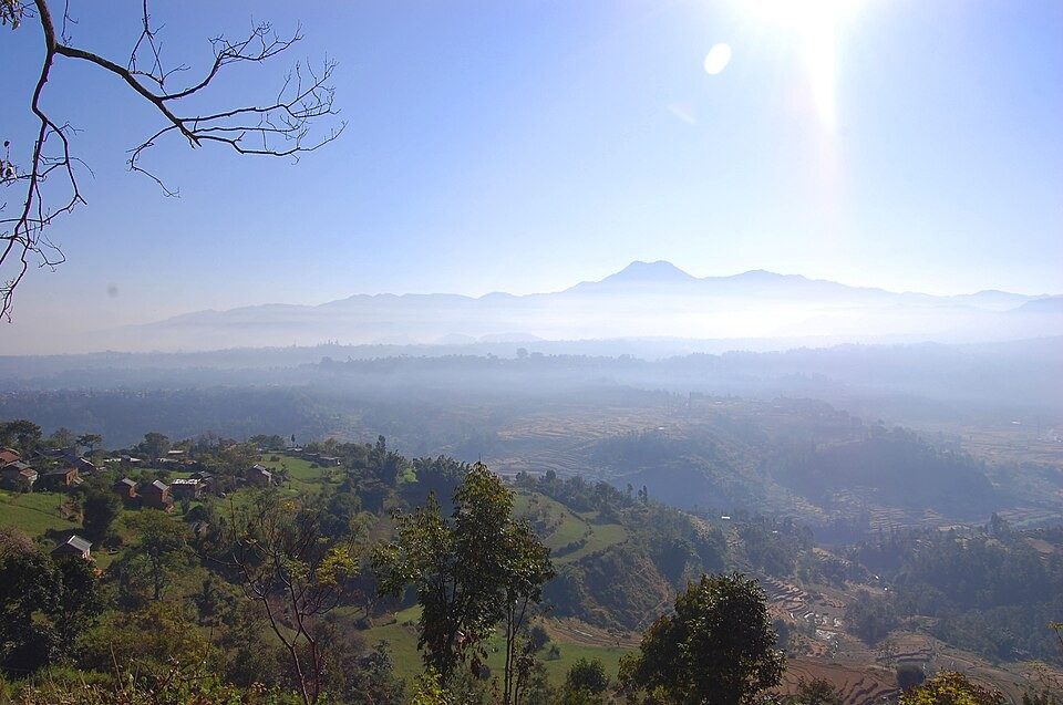 Hazy valley views opening between the trees