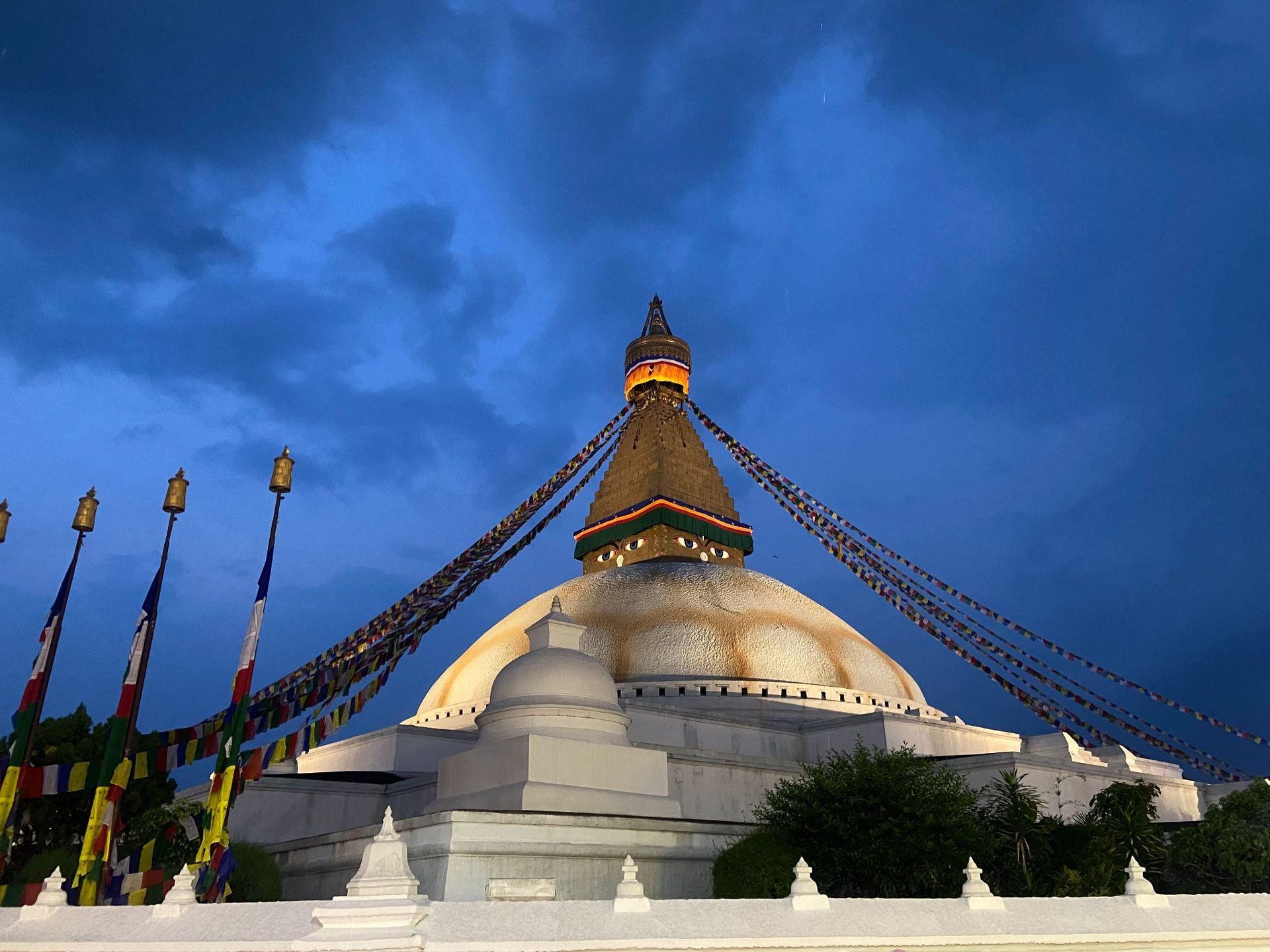 Boudhanath Stupa and prayer flags at blue hour